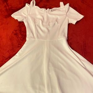 All white off the shoulder flared dress.